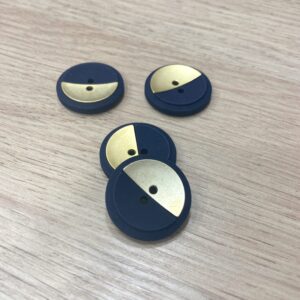 Bouton plastique doré et bleu
