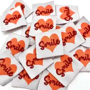 Etiquette à coudre Smile rouge