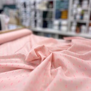 Tissu Plumetis coton rose fluo
