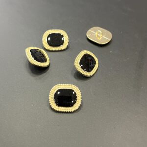 Bouton métal doré et noir