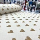 Tissu maille beige coeur doré
