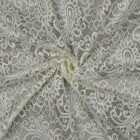 Tissu dentelle festonnée écru